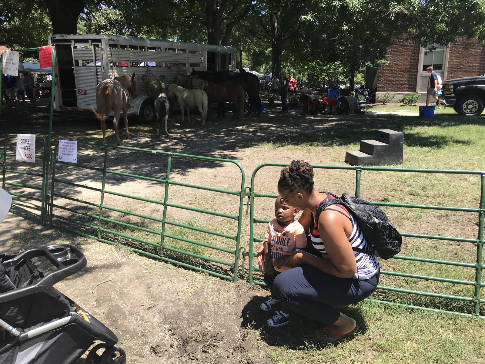 Sincere and his mom saying hi to the ponies